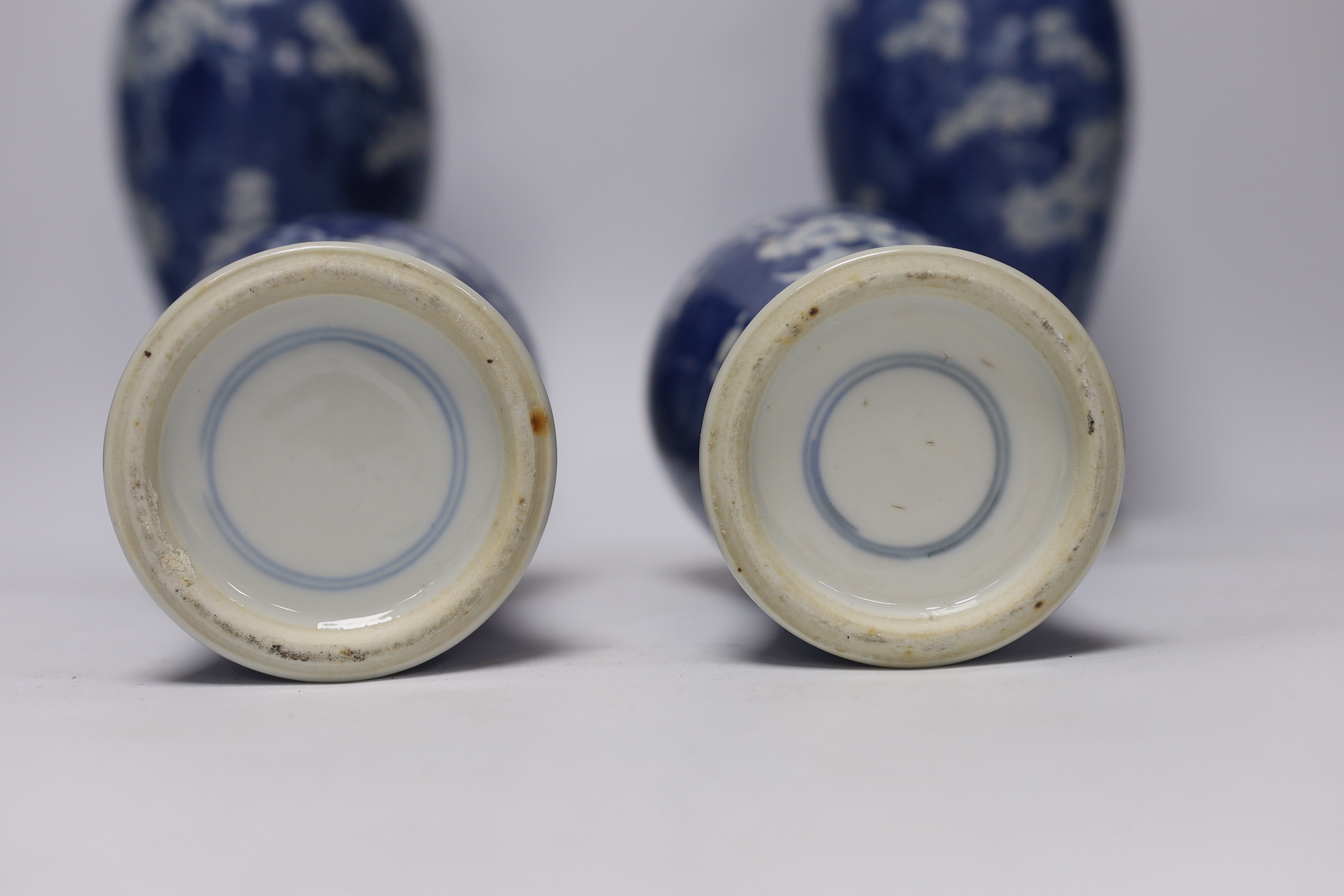 Two pairs of late 19th/early 20th century Chinese blue and white prunus vases, one pair with covers, tallest 30cm